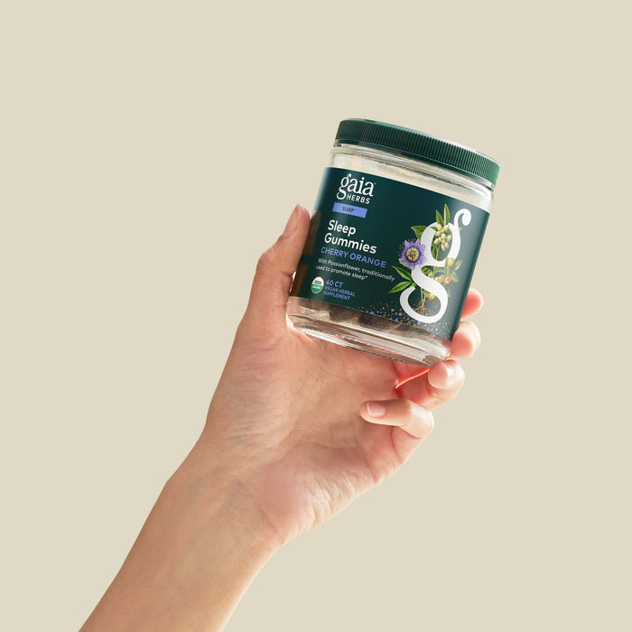 Sleep Gummies 40 count Bottle Held In A Person's Hand