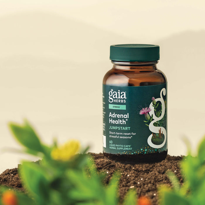 Gaia Herbs Adrenal Health Jumpstart 60 count supplement bottle with plants in the foreground