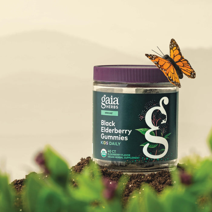Gaia Herbs Black Elderberry Gummies Kids Daily 40 count bottle with a butterfly on a natural background
