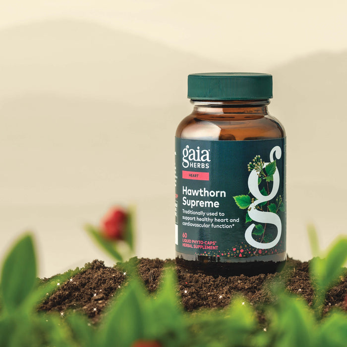 Gaia Herbs Hawthorn Supreme 60 count supplement bottle on a natural background with plants.