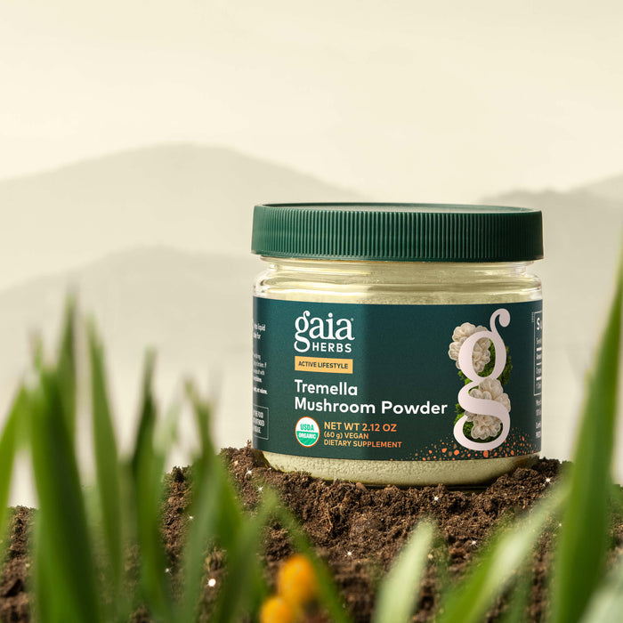 Jar of Gaia Herbs Tremella Mushroom Powder on a natural background with greenery.