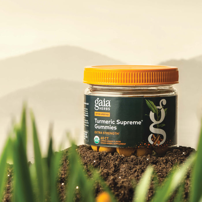 Gaia Herbs Turmeric Supreme Gummies Extra Strength 60 count supplement bottle on a natural background
